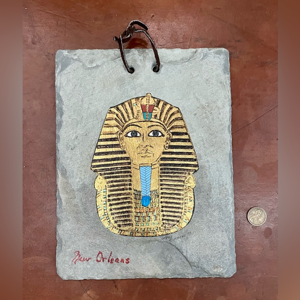 King Tutankhamun bust hand painted on building slate